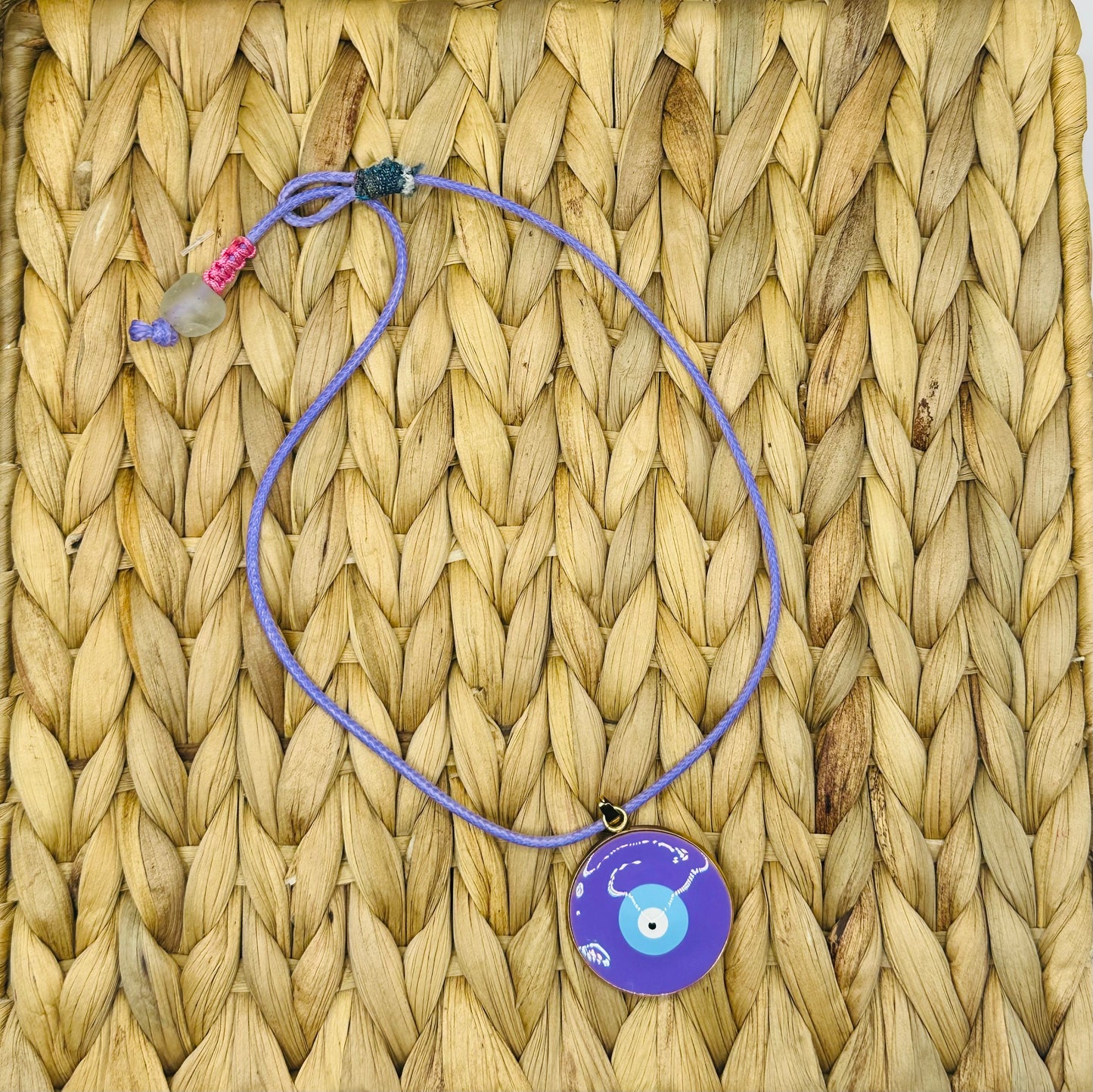 Hand made necklace - purple cord with Turkish eye pendant