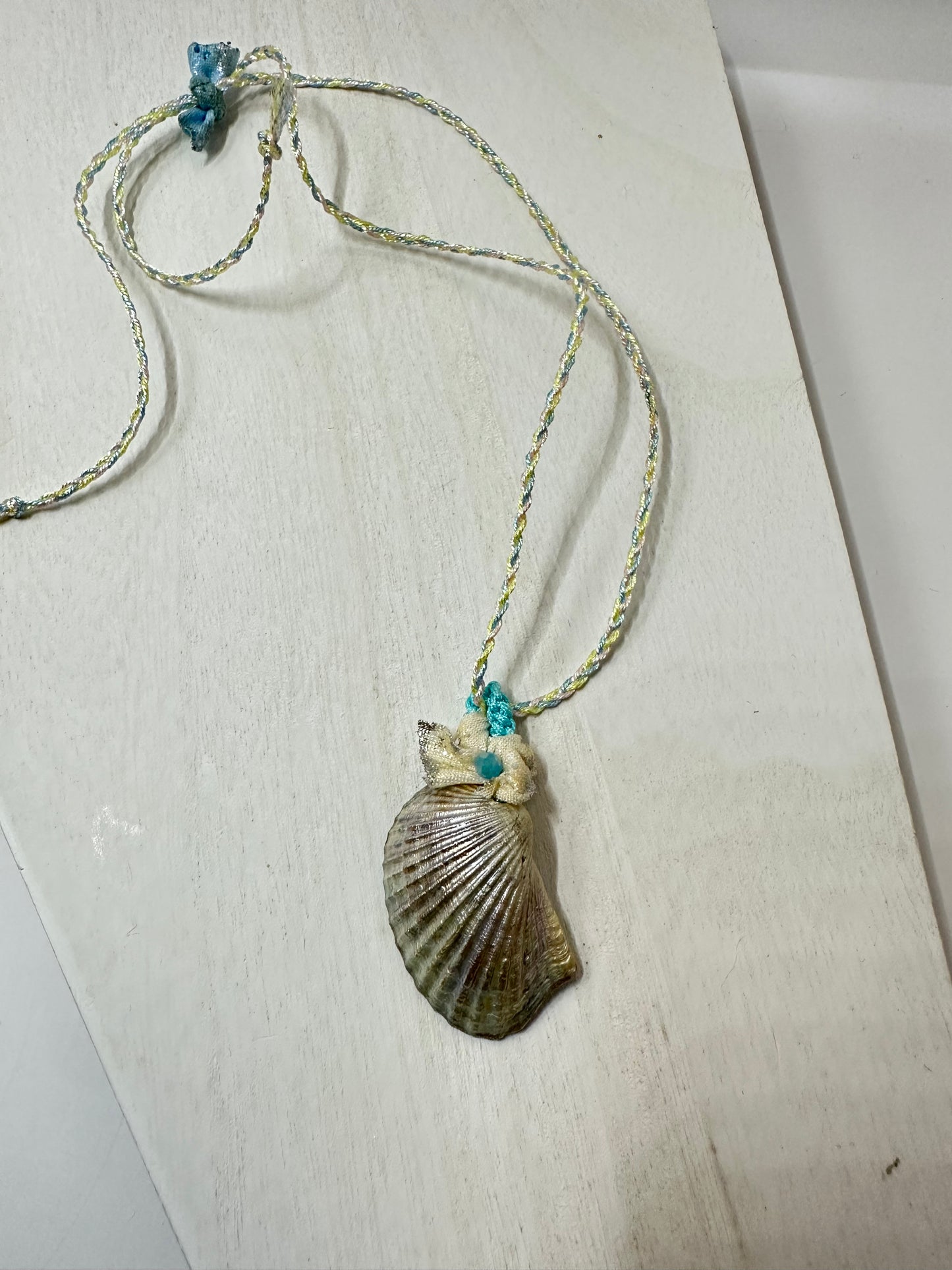 Hand made necklace- satin threaded cord and sea shell